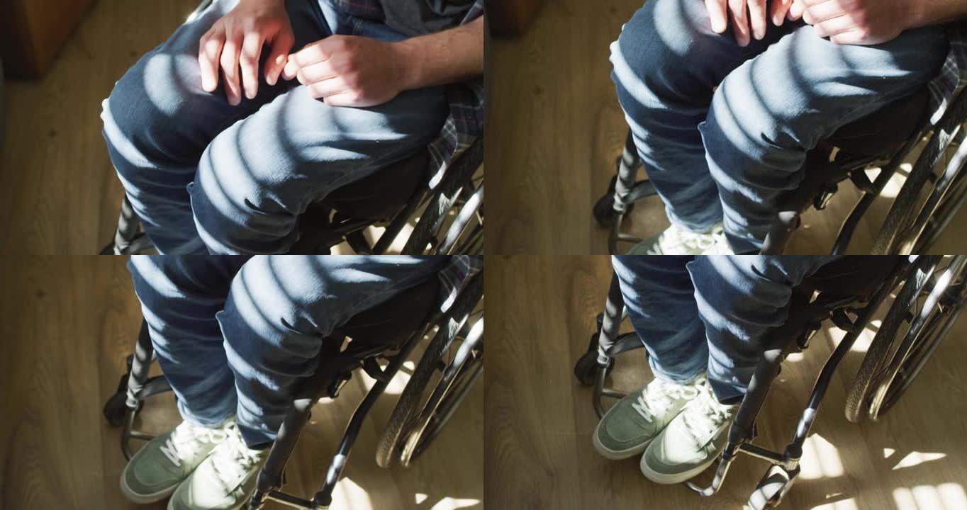 坐在轮椅上的高加索残疾人的特写镜头