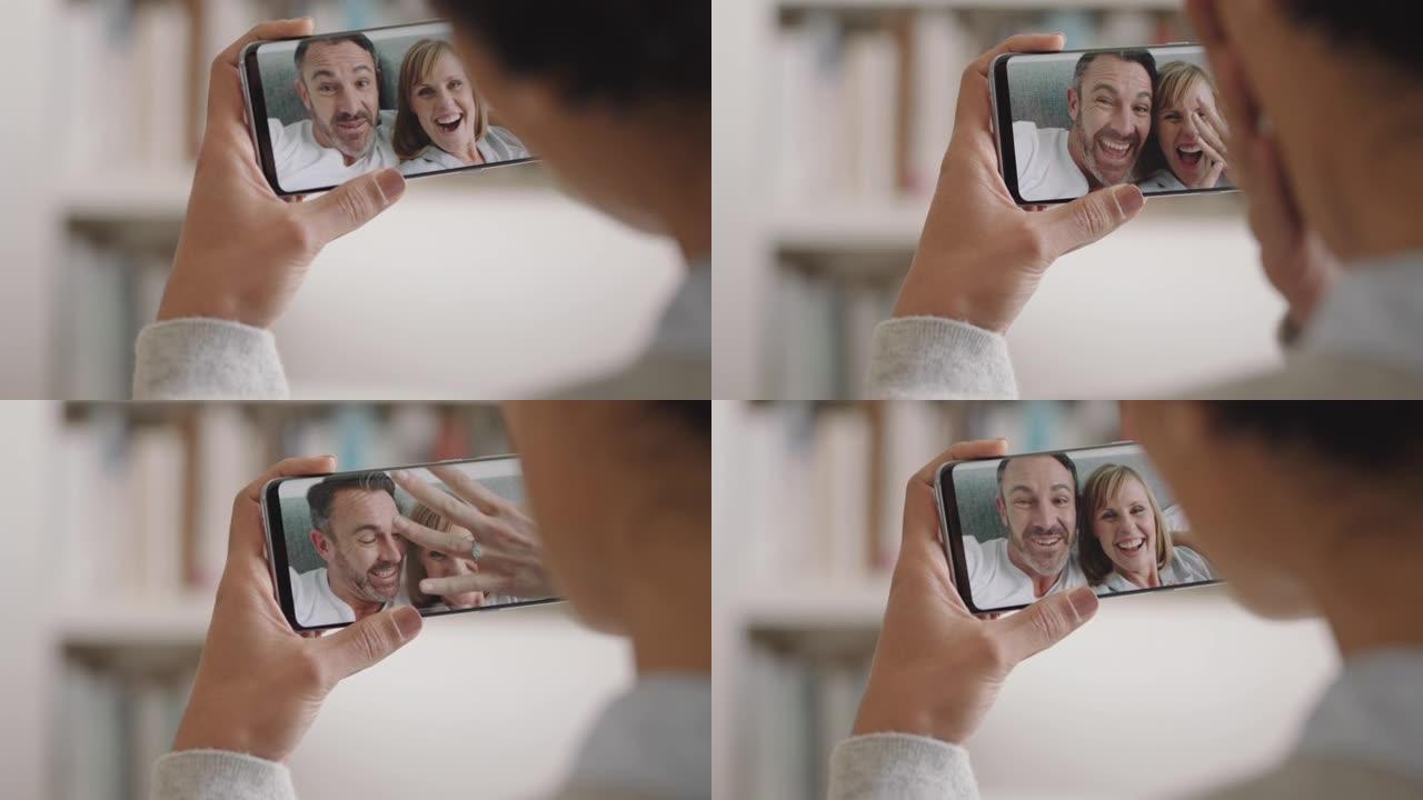年轻女子使用智能手机视频聊天快乐夫妇展示结婚戒指分享订婚享受手机连接上的庆祝关系4k镜头