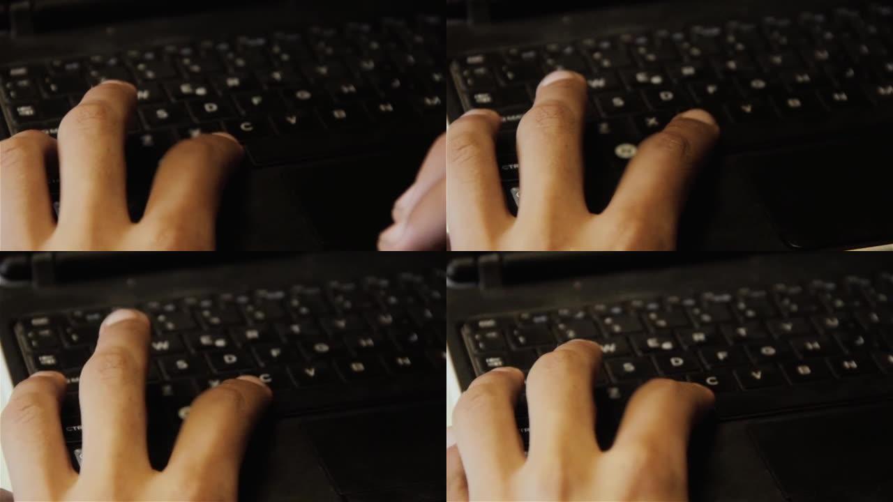盲人学生的手在电脑课上学习使用键盘。特写。