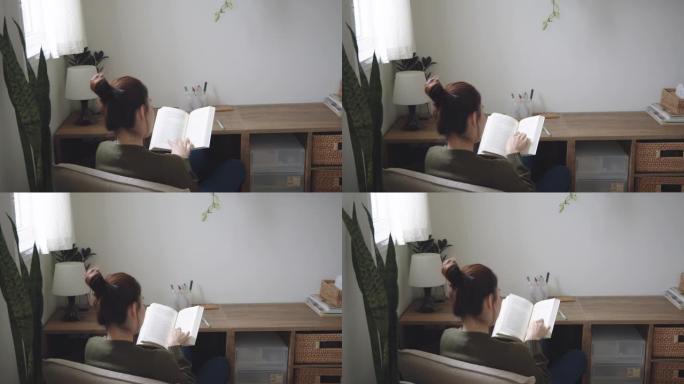 年轻女子在公寓里看书