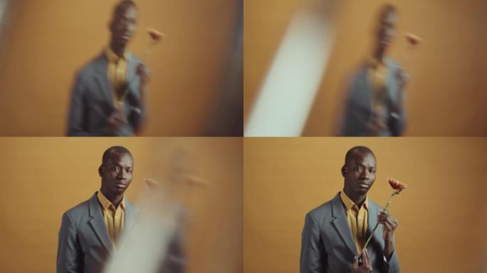 带花的年轻绅士非洲人黄色广告片人物肖像