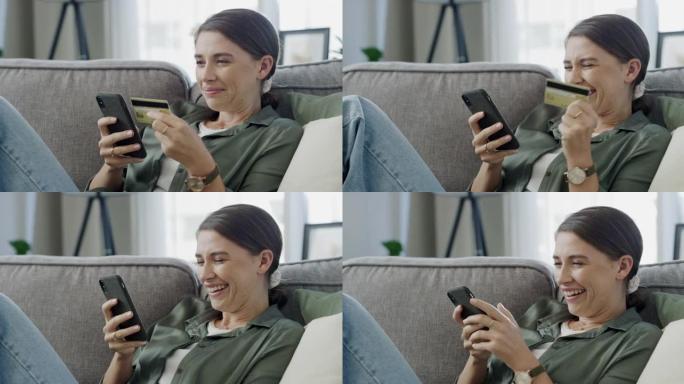 一名年轻女子使用智能手机在家网上购物的4k视频片段