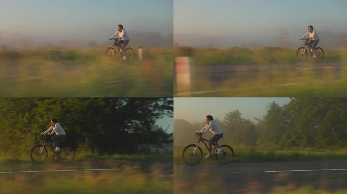 中年妇女在乡村道路上骑自行车