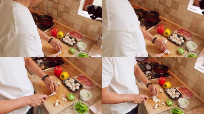 午餐沙拉，蔬菜烹饪和男人在厨房用刀切割食物，对晚餐的营养感到满意，并为饮食准备蘑菇。健康厨师饿了吃早