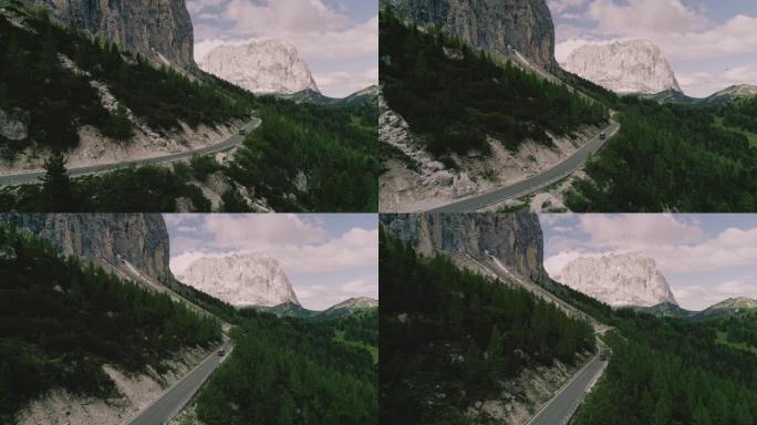 无人机拍摄了在山路上行驶的面包车