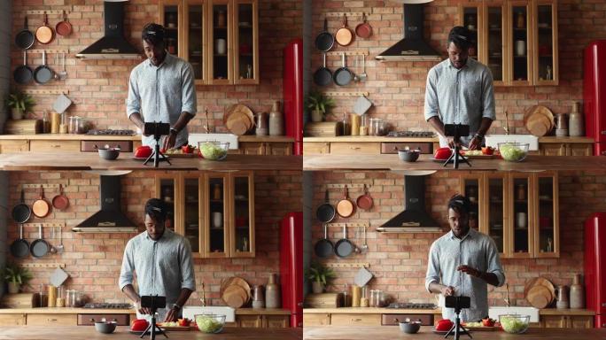 年轻的黑人食物博主在家庭厨房拍摄vlog