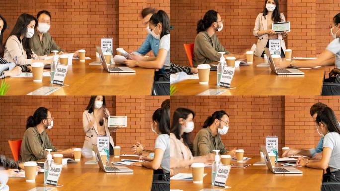 4K UHD放大延时新的正常会议，并在会议室用洗手液集思广益，所有商务人士都戴上防护口罩，以防止在全