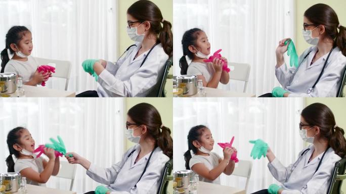 女医生与小女孩玩手术手套