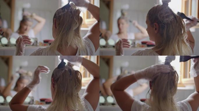 女人在镜子前染发自己染头发的女人背影照镜