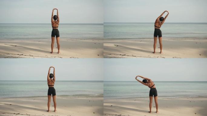 女人在海滩上锻炼五彩纷呈绘声绘色嘲风咏月