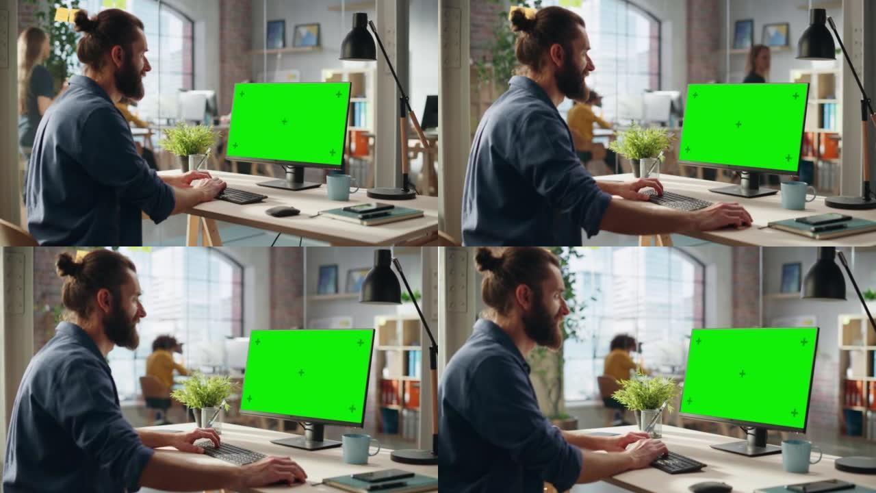 创意项目经理在带有绿屏模拟显示的台式计算机上工作。波西米亚风格启发了英俊的营销专家计划一个项目，浏览