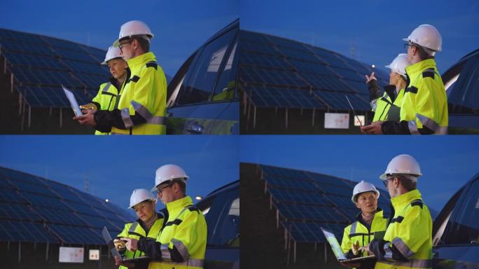 SLO MO两名现场工程师在蓝色小时观察光伏电站的运行情况