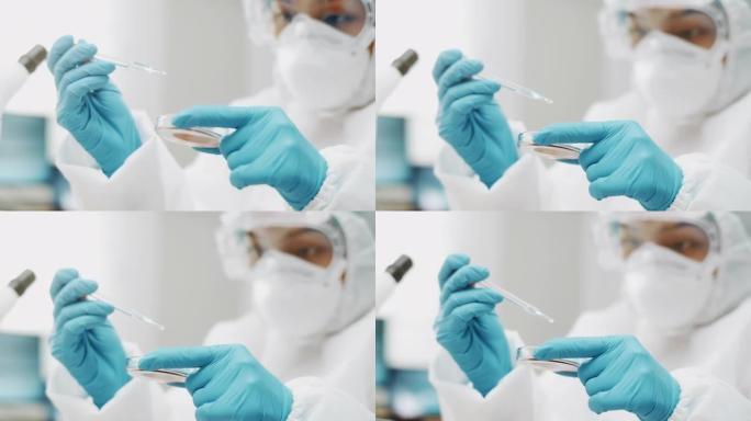 科学家在实验室工作时将一些血液粘在显微镜载玻片上