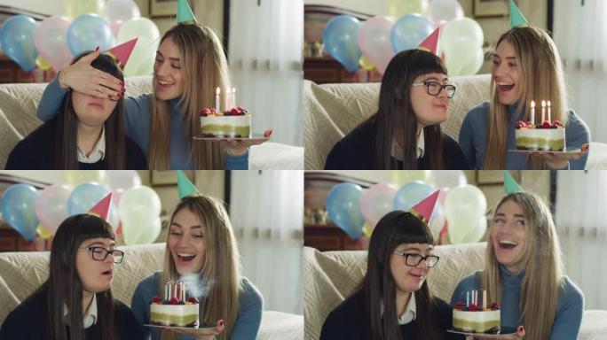 快乐年轻女子的真实照片很开心在家庆祝患有唐氏综合症的十几岁妹妹的生日。爱的概念，家庭，残疾人，假期，