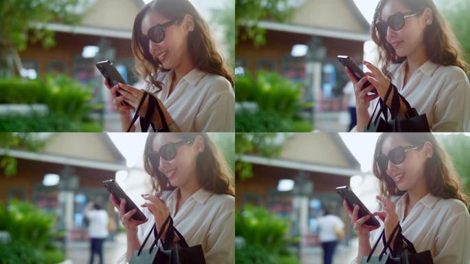 年轻女子使用智能手机在商店自助购物