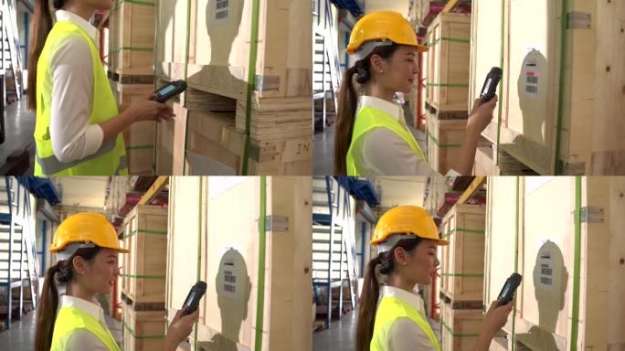 使用条码枪在仓库地板上读取条码的亚裔女工程师肖像。女人可以为男人工作，这意味着社会的平等。