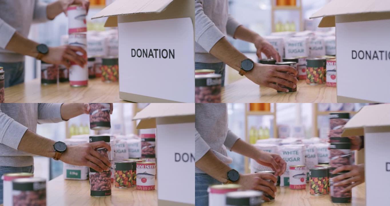 4k录像，一名男子组织罐头食品，将其包装到盒子中进行捐赠