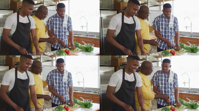 非裔美国人的高级父亲和两个成年儿子站在厨房做饭并聊天