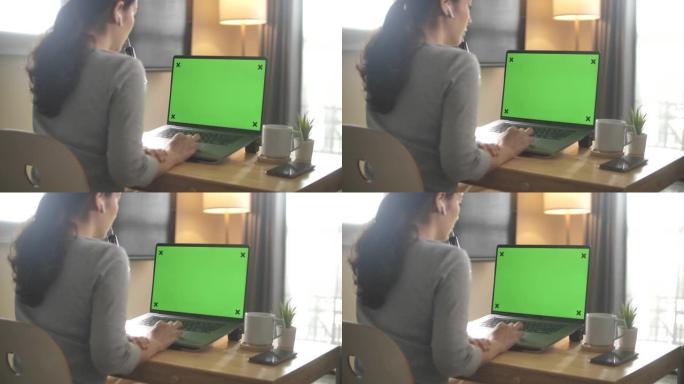 肩部使用带有绿屏显示的笔记本电脑