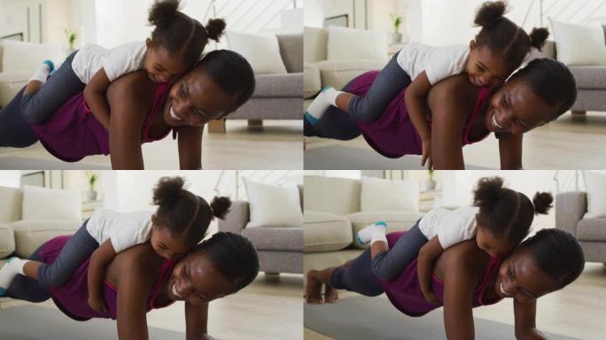 快乐的非洲裔美国母女在家锻炼