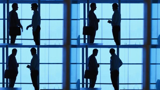 剪影商务人士在公司办公室握手会议，为合作伙伴交易问候客户，在办公室4k握手欢迎机会