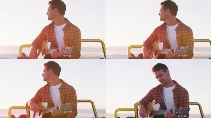 快乐的高加索人坐在海边的沙滩车里弹吉他