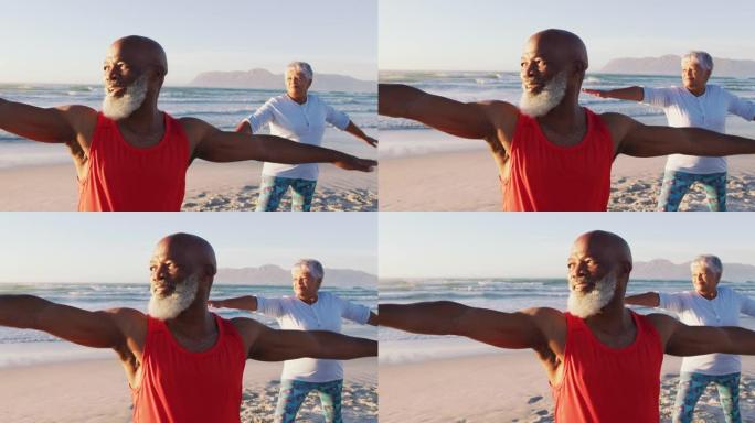 资深非裔美国夫妇在海滩练习瑜伽