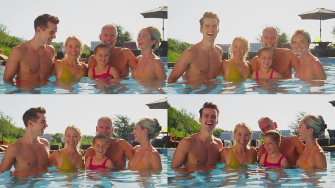 暑假在游泳池放松的微笑多代家庭肖像
