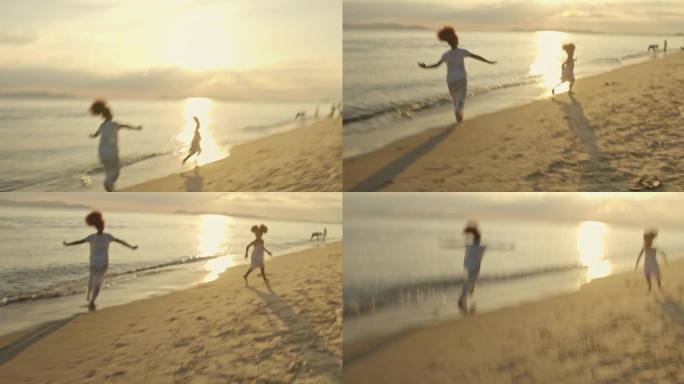 度假中的SLO MO两个女孩在海滩上玩耍