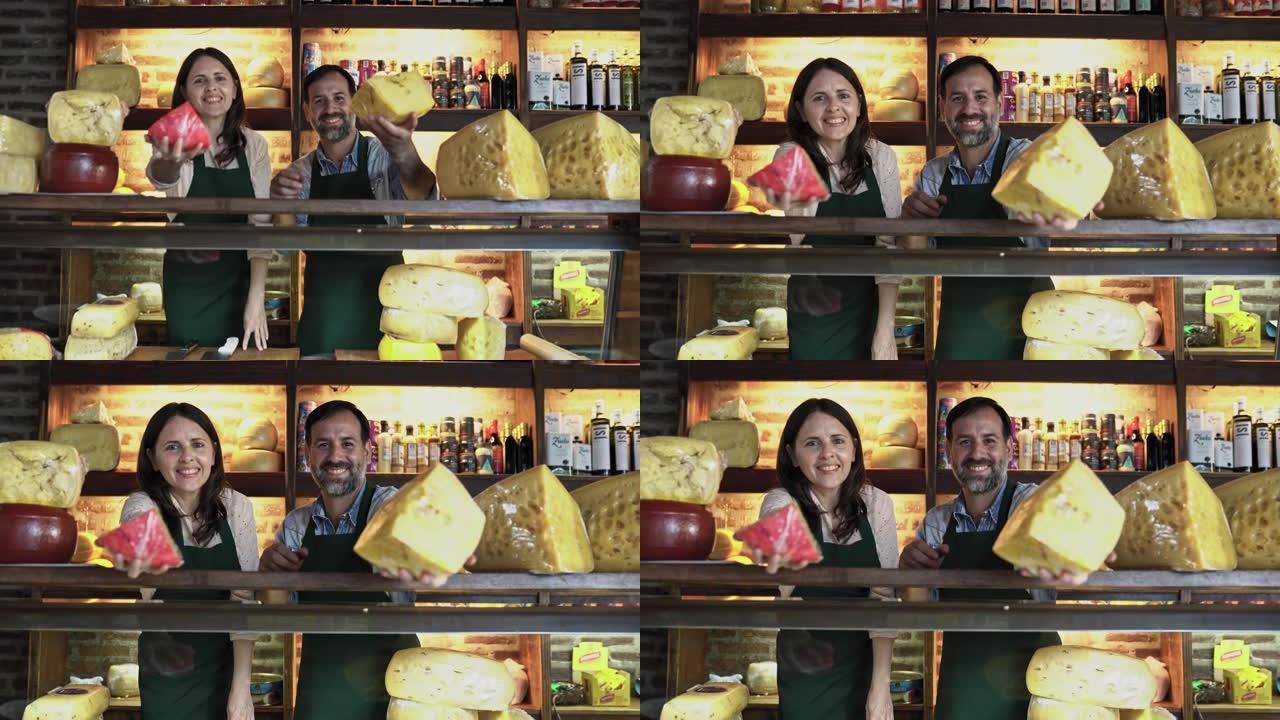 开朗的店主展示他们的美食奶酪