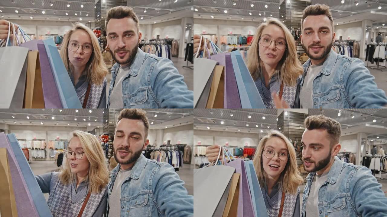 POV快乐年轻夫妇在购物中心视频聊天