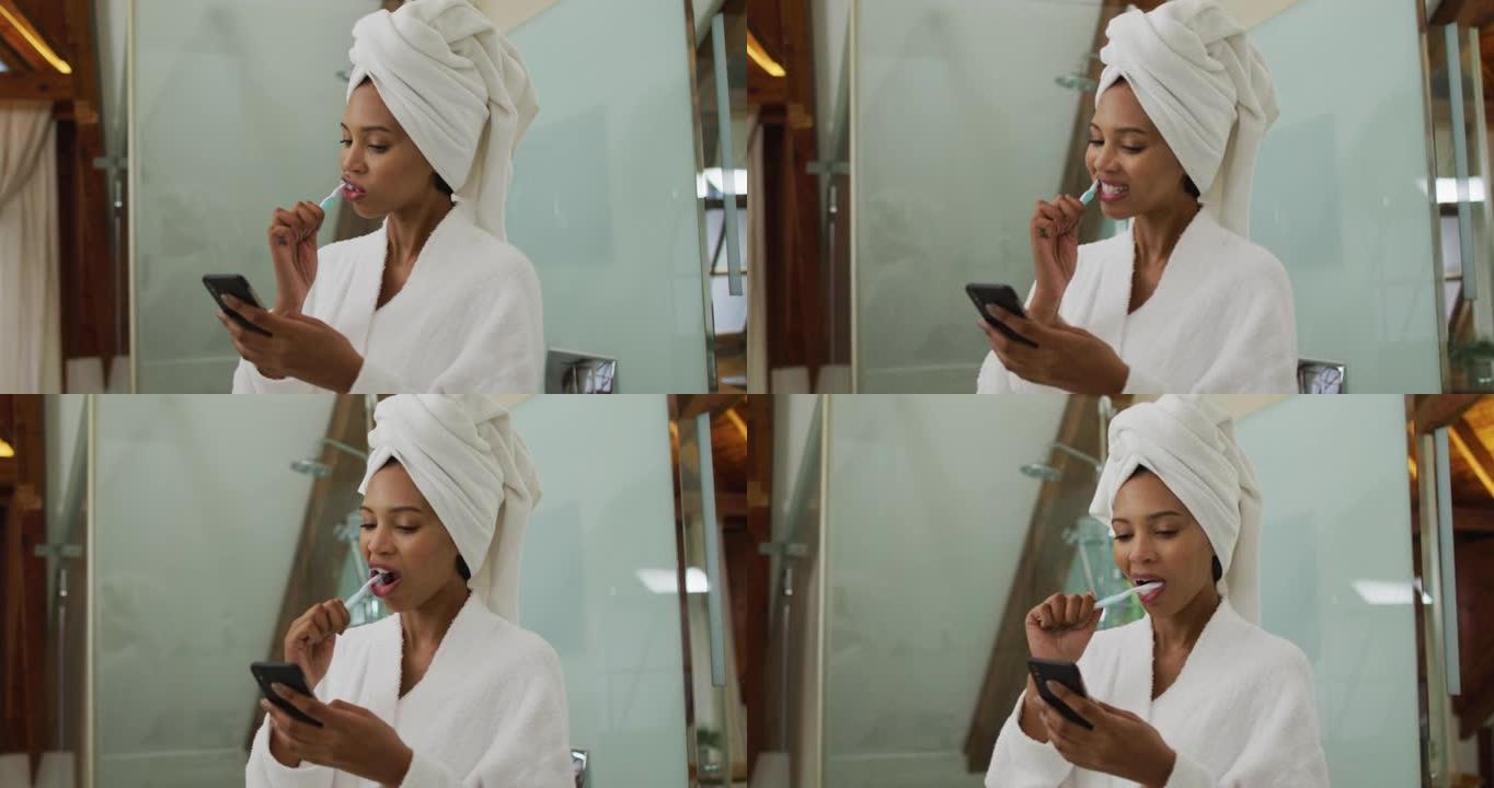 混合种族妇女使用智能手机刷牙