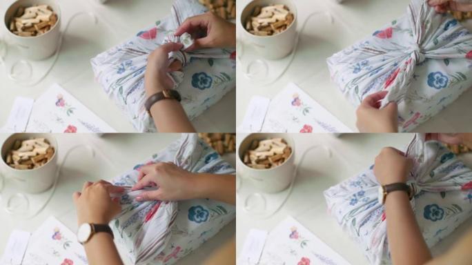 年轻的亚洲艺术家使用环保材料和包装将包裹运送给她的客户。