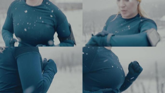 SLO MO女人在雪地里慢跑时检查她的智能手表