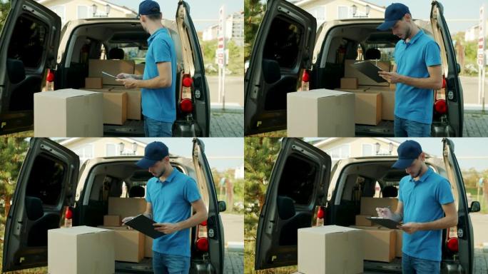 年轻的男性快递员在面包车中处理文件检查包裹的慢动作