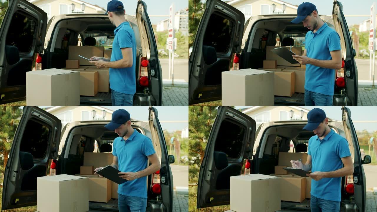 年轻的男性快递员在面包车中处理文件检查包裹的慢动作