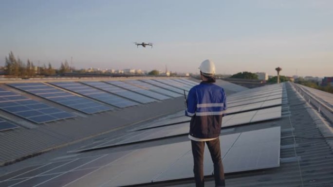 亚洲工程师服务和无人机检查员检查太阳能电池