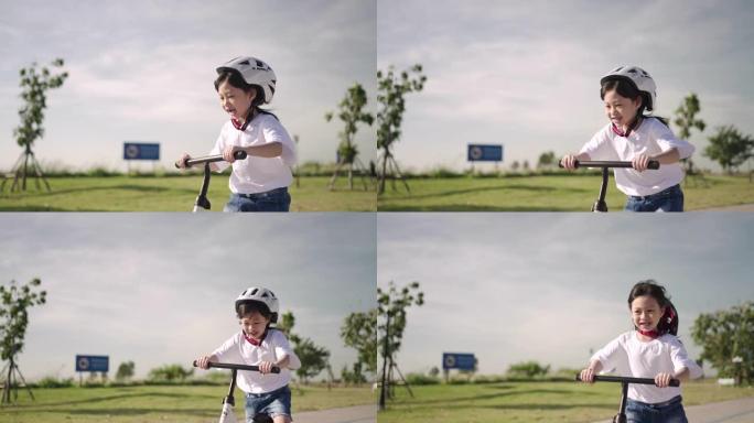 带着运动头盔骑自行车玩得开心的孩子