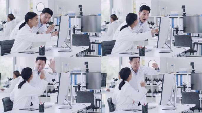 在猴痘治疗基因医学研究突破后，实验室科学家团队以高五姿态庆祝。两位病理学家，生化工程师使用计算机和显