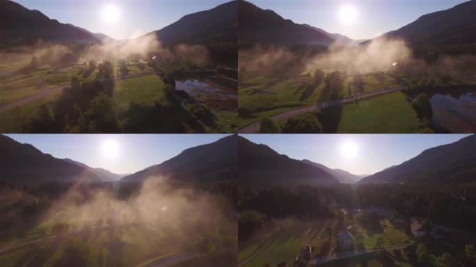 空中: 飞过金色发光的秋天晨雾在山谷中升起
