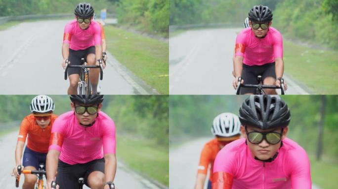 亚洲中国男运动员在周末与他的运动队一起在农村地区进行自行车练习