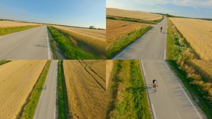 空中骑自行车的人在穿越乡村的道路上骑自行车