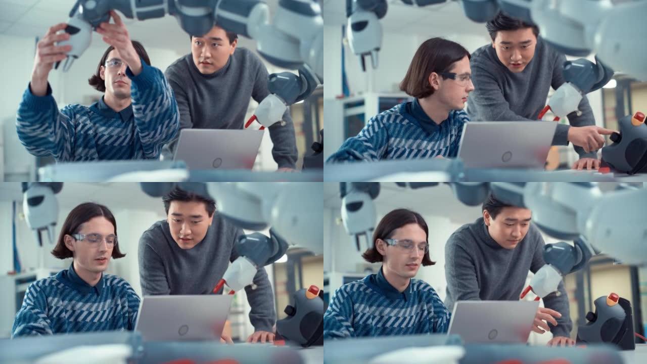 专业的亚洲年轻工程师看着屏幕，告诉他的想法，他的同事使用笔记本电脑工作，并在工厂车间为生产线编程机械