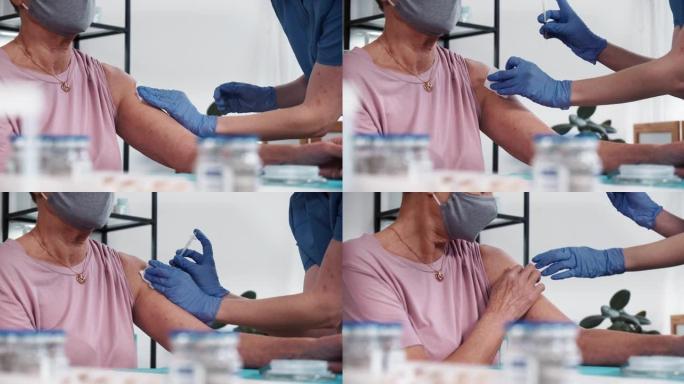 医生穿着蓝色磨砂膏，医用手套给高级女性患者注射皮下注射针疫苗。