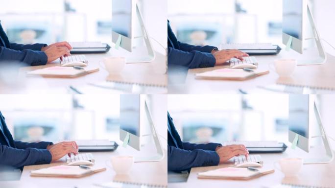 男人的手在电脑键盘上打字在他的办公桌上工作的特写。运筹学分析师通过电子邮件发送创造性数据挖掘方法的反