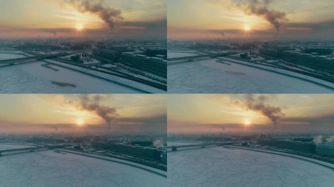 日落时用无人驾驶飞机在圣彼得堡白雪皑皑的河流的城市景观上的鸟瞰图