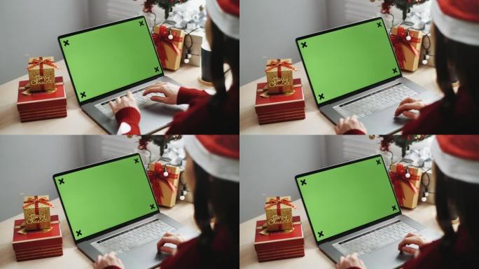 圣诞节期间使用色度键笔记本电脑的特写手