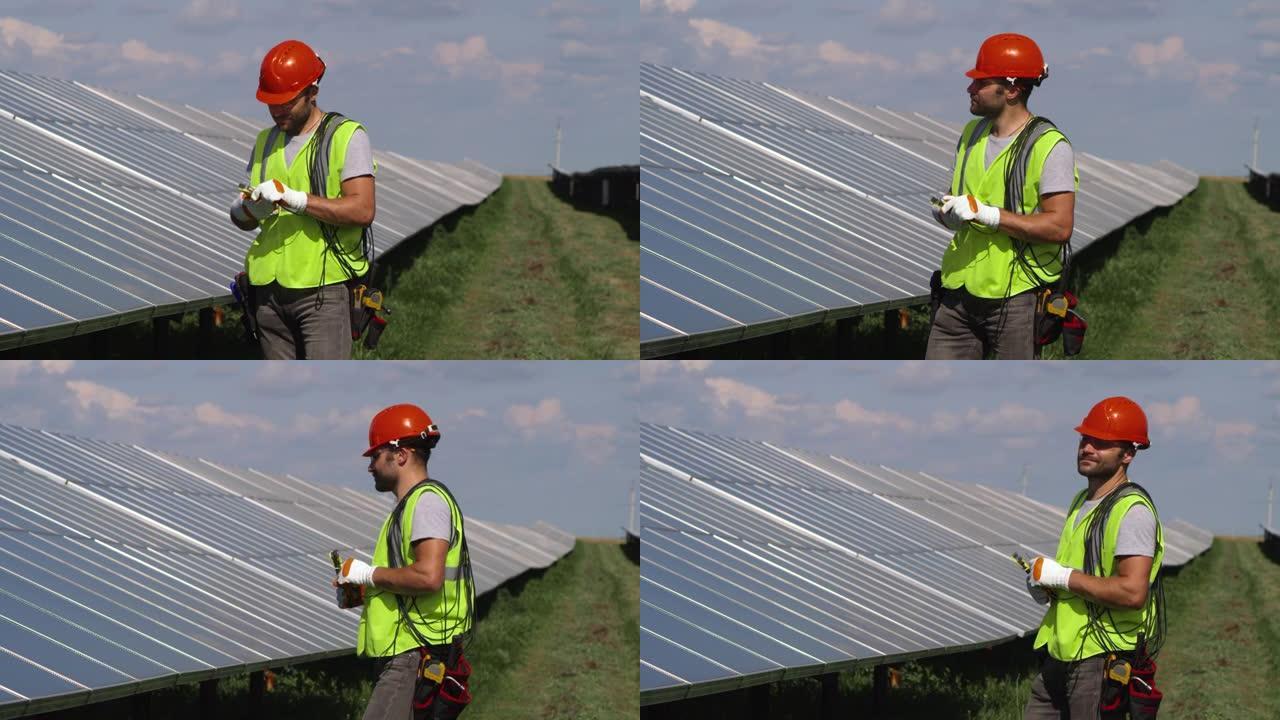 男子在太阳能农场准备电线