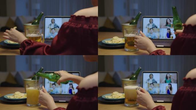 年轻快乐的亚洲女性享受放松之夜派对活动在线庆祝节日，与朋友在家倒杯啤酒和瓶子展示啤酒泡沫通过视频通话