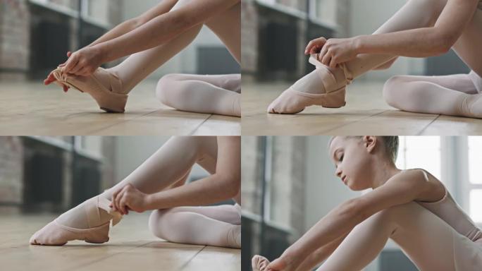 小芭蕾舞演员在训练前系脚尖鞋